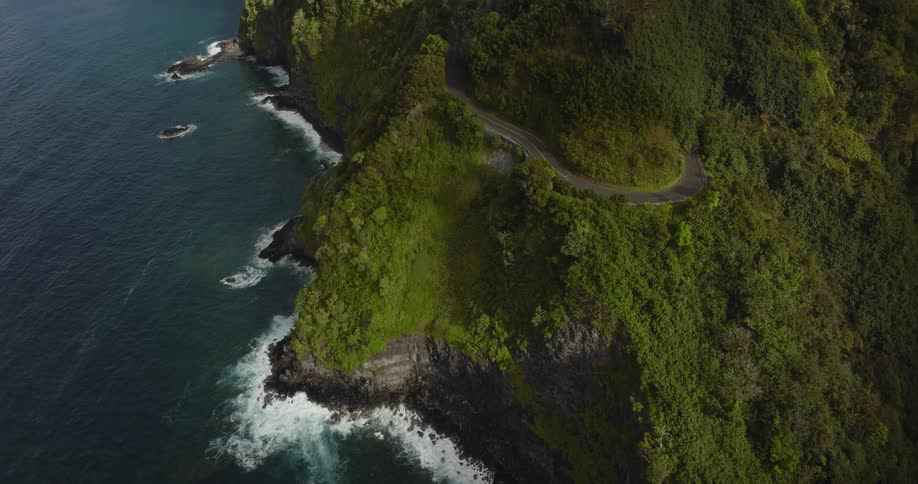 Aerial view of land near the ocean is displayed