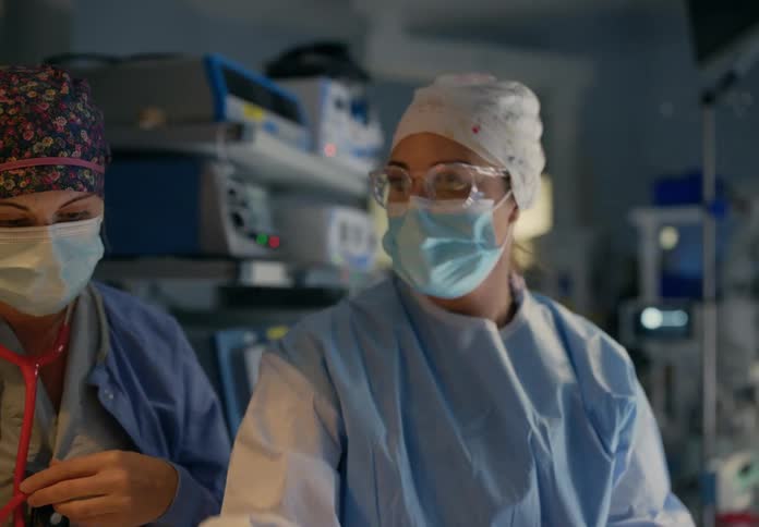 Doctors are performing a procedure on a patient