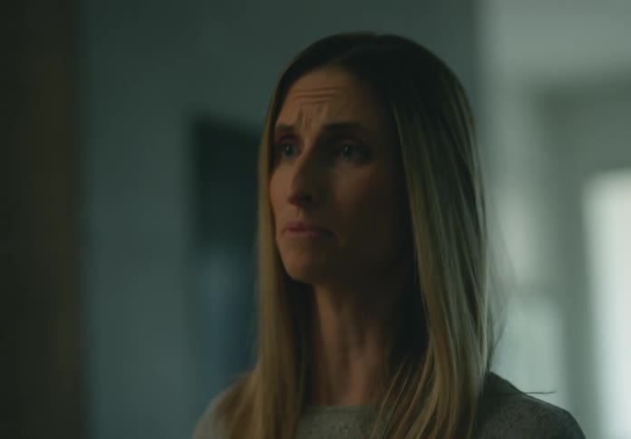 Mother and adult daughter arguing inside a house while the daughter walks away and goes upstairs