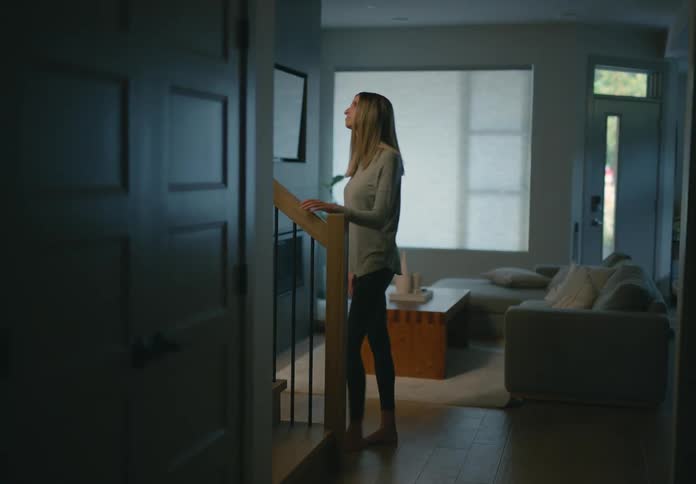 Two friends are talking in their house together