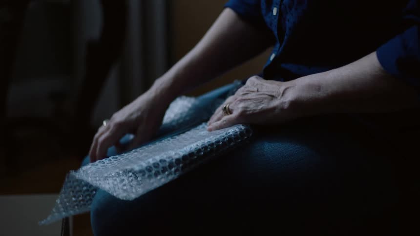 A woman packing up items