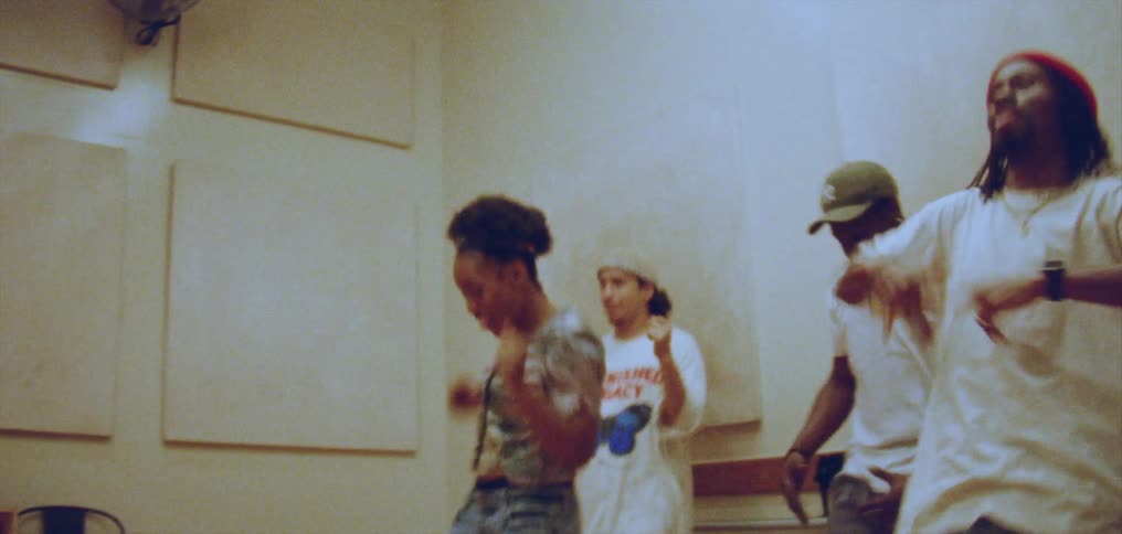 Dance troop practices in dance studio