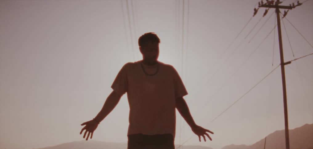 A man performs a modern dance outside