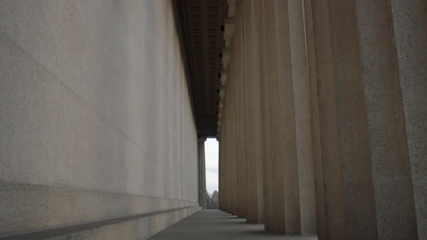 Hallway between wall and columns