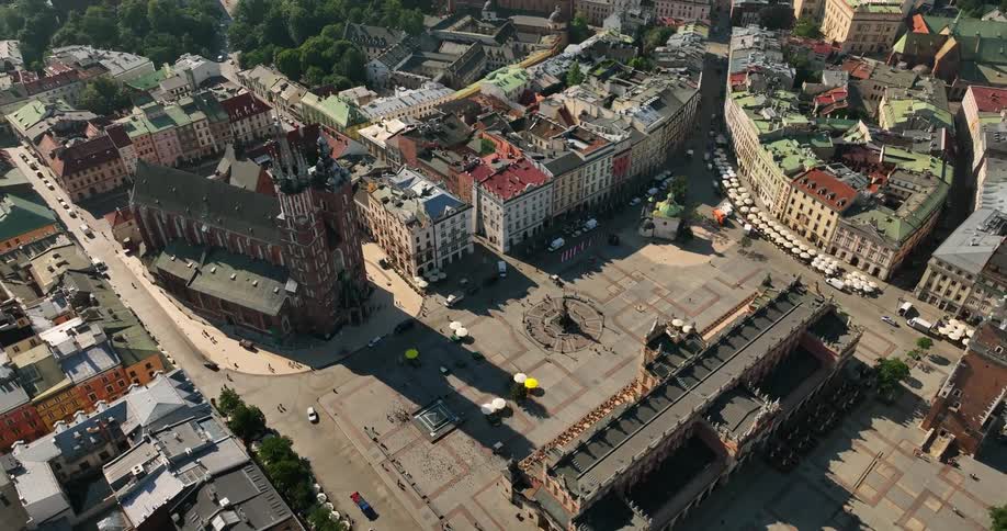 The town square has vehicles driving through