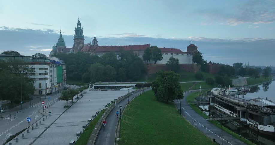A person is jogging near the shore of the city