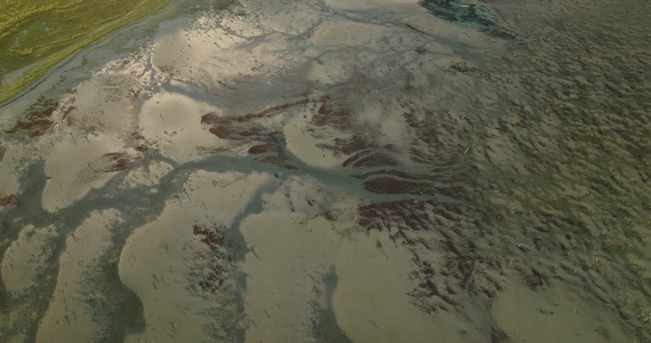 An aerial view of sandy barren land and terrain