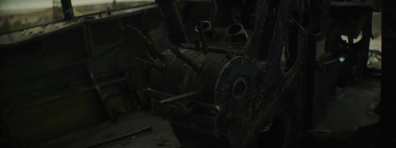 Cockpit on the dismantled interior of an abandoned airplane fuselage in the countryside