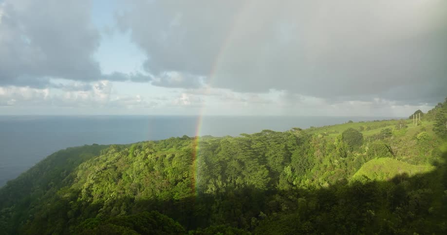 A rainbow over a hillside