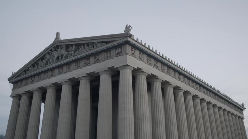 A pale stone building during the day