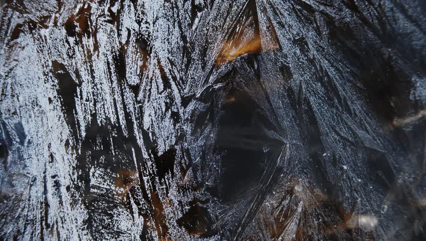 Time lapse close up of of sharp thin frosting ice crystals forming