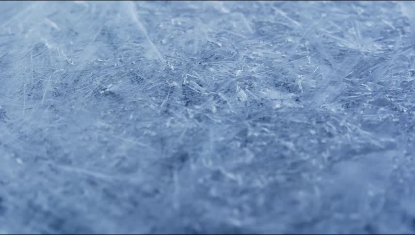 Cracks form under a layer of ice