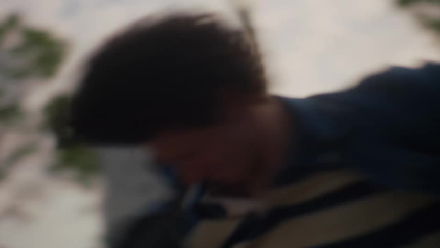 Man spins as he moves across ground outdoors