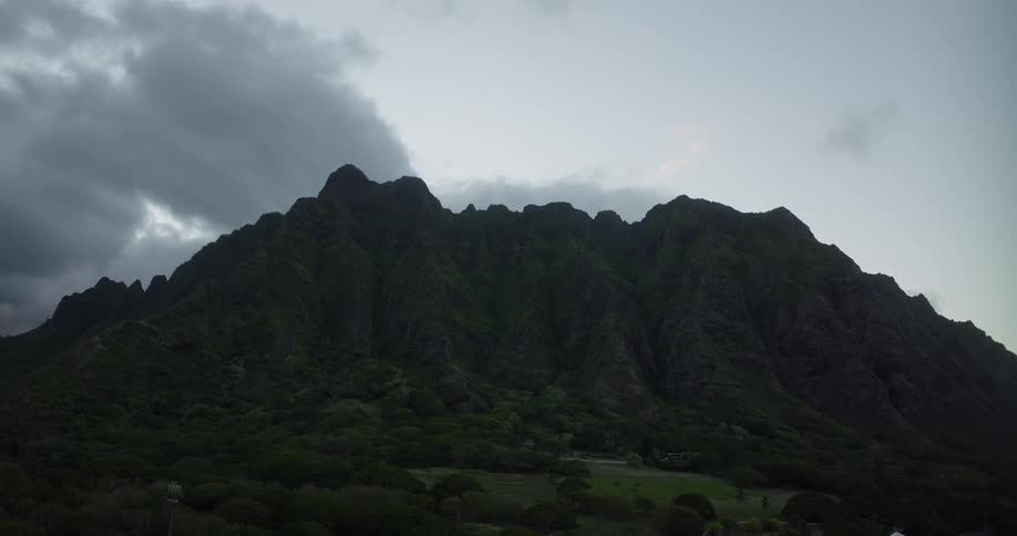Aerial view of the silhouette of a mountain range against the morning sky