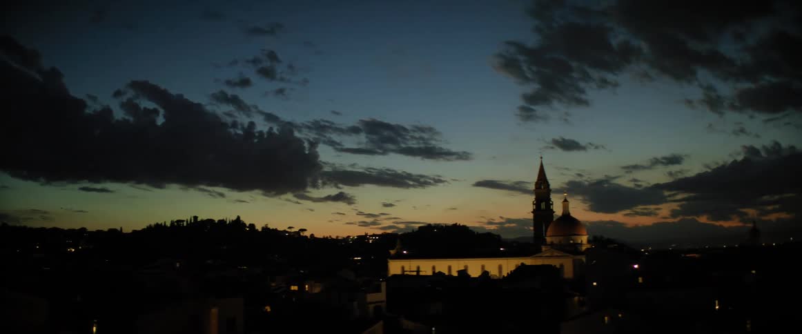 Buildings and clouds on a dark evening