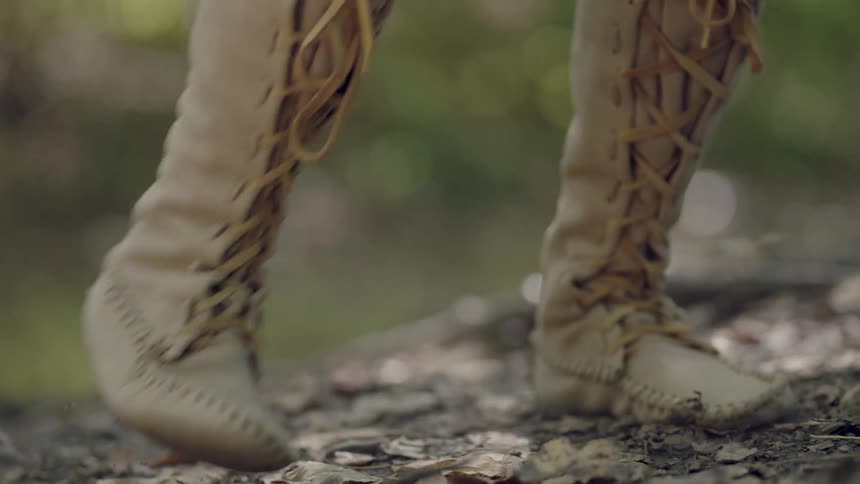 Booted feet dancing outdoors