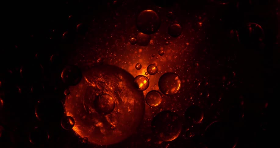 Close up of transparent air bubbles in oil