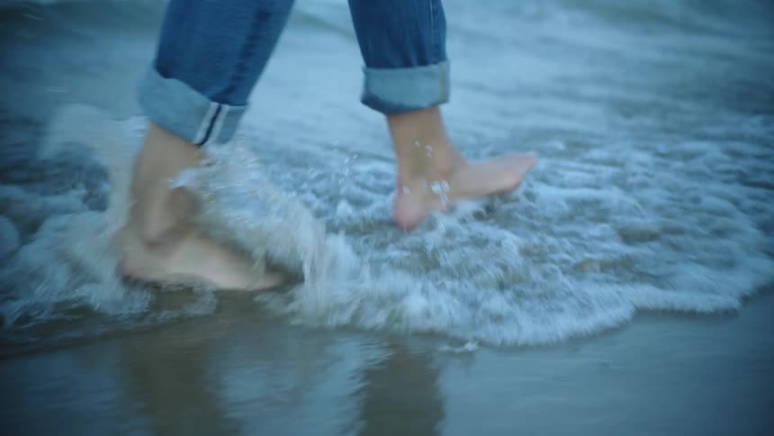 A person walking at the beach