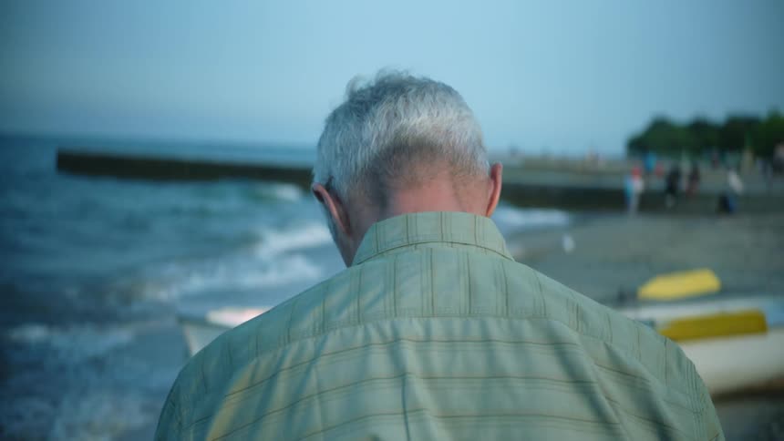 A man walks on the beach