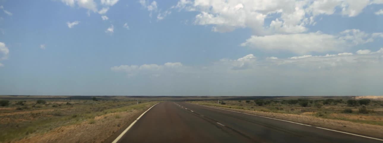 Road trip proceeds along highway through the countryside