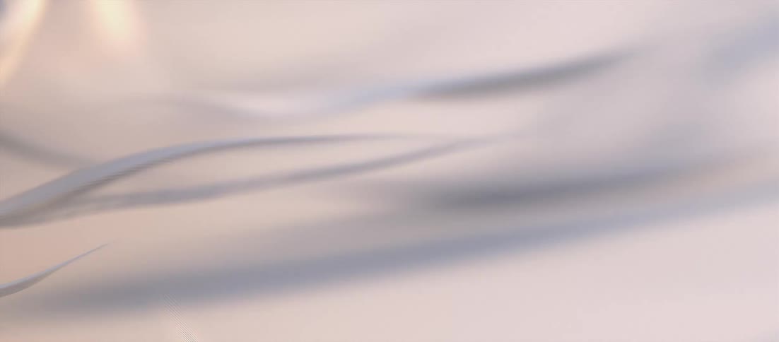A white satin sheet ripples in the wind