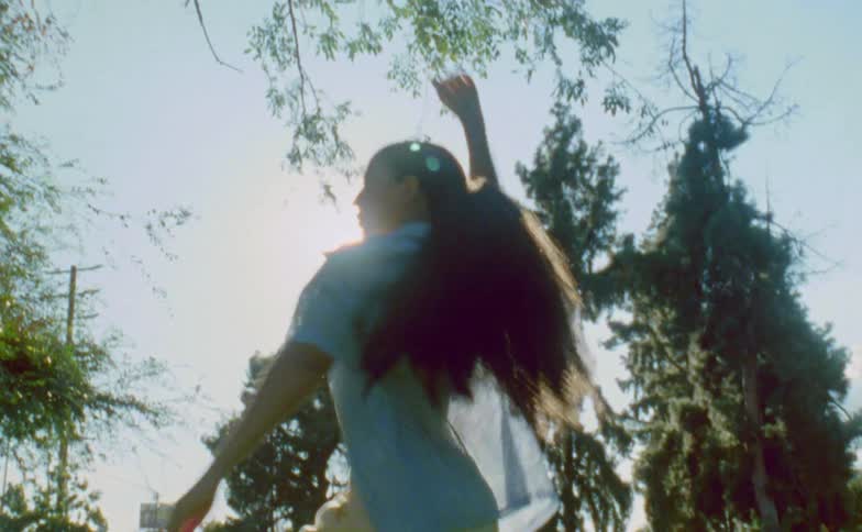 A woman dances in the woods