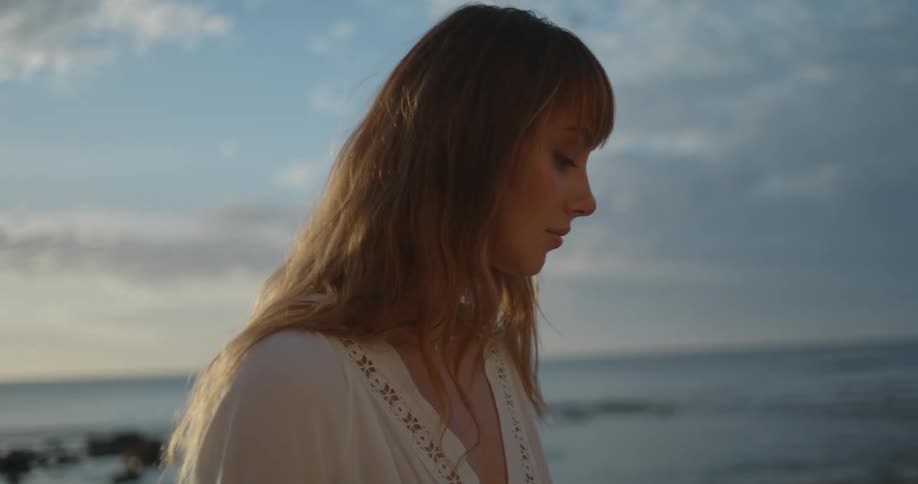 A woman walking outdoors at the beach