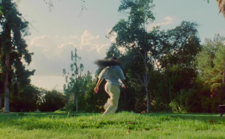 A woman dancing outdoors