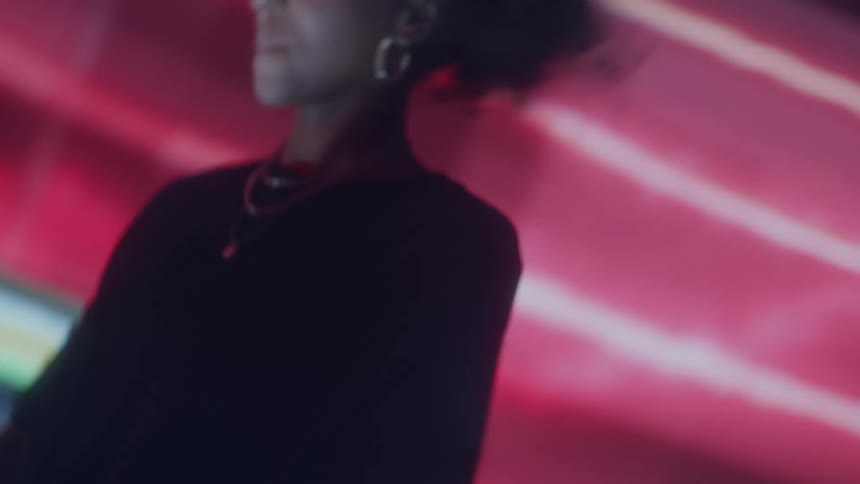 A deejay dances while playing a set in the club