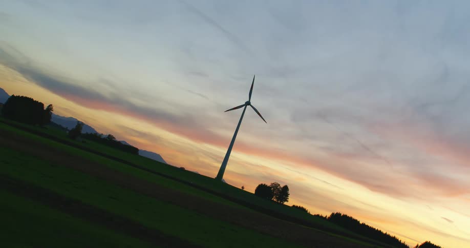 A wind turbine spinning in a field