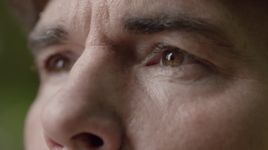 A man is staring forward with interest