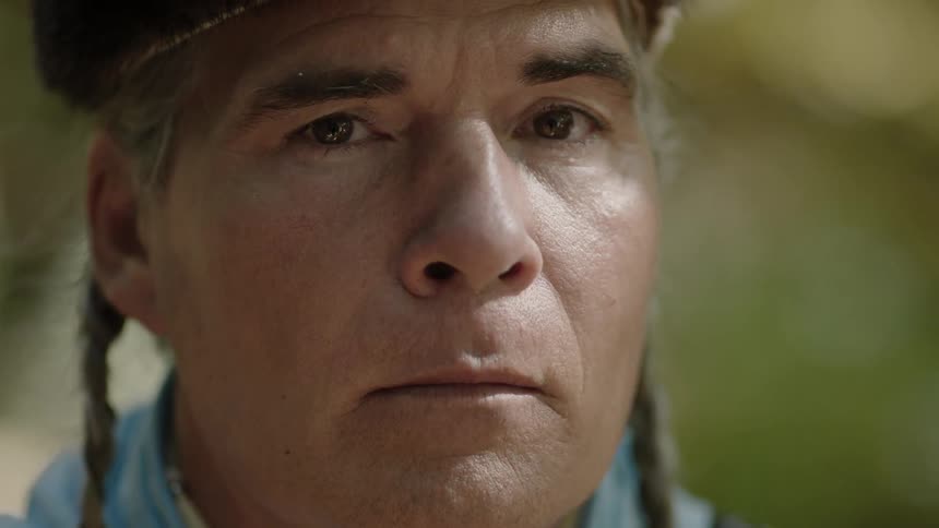 Tribal man looking stoically into the camera
