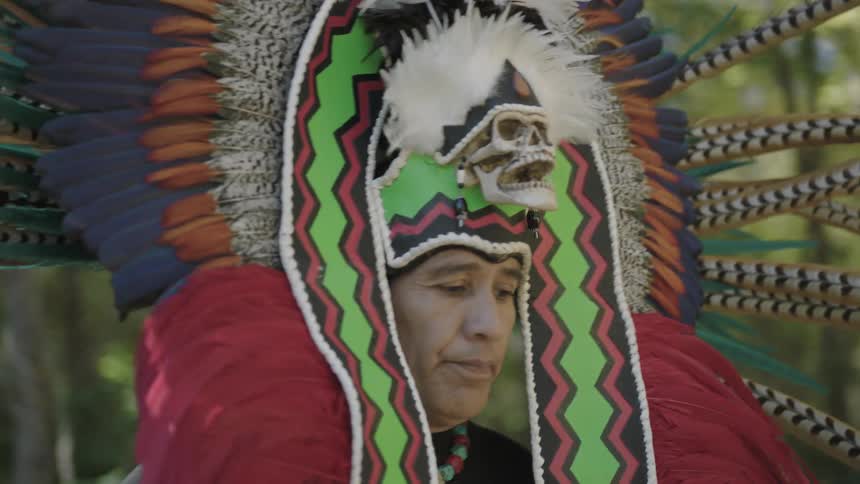 A man in costume is dancing