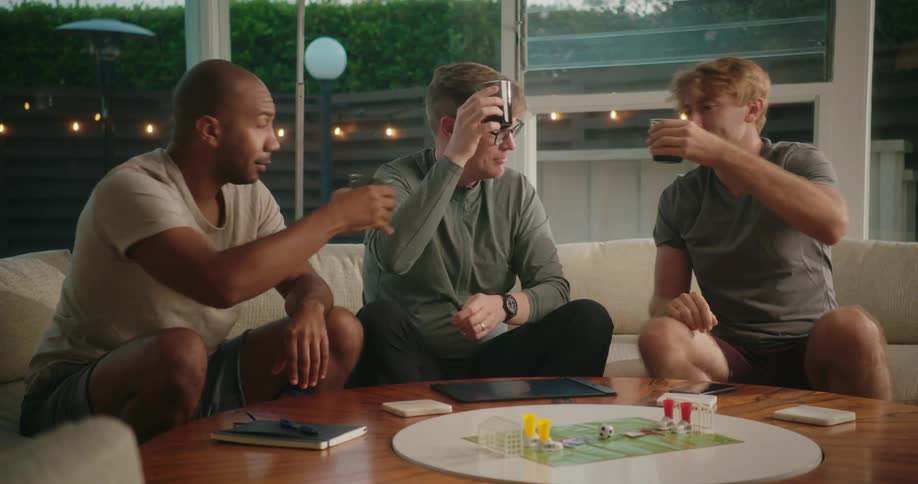 A group of friends are playing a game together indoors