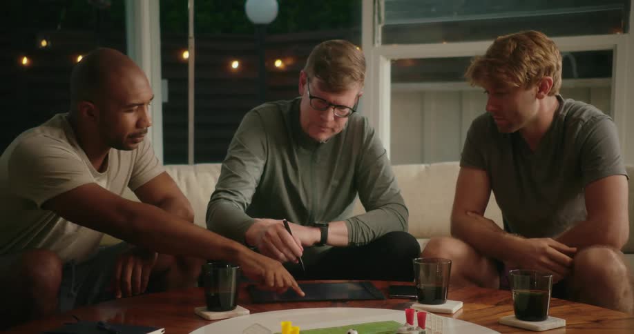 Friends play a game on the tablet together