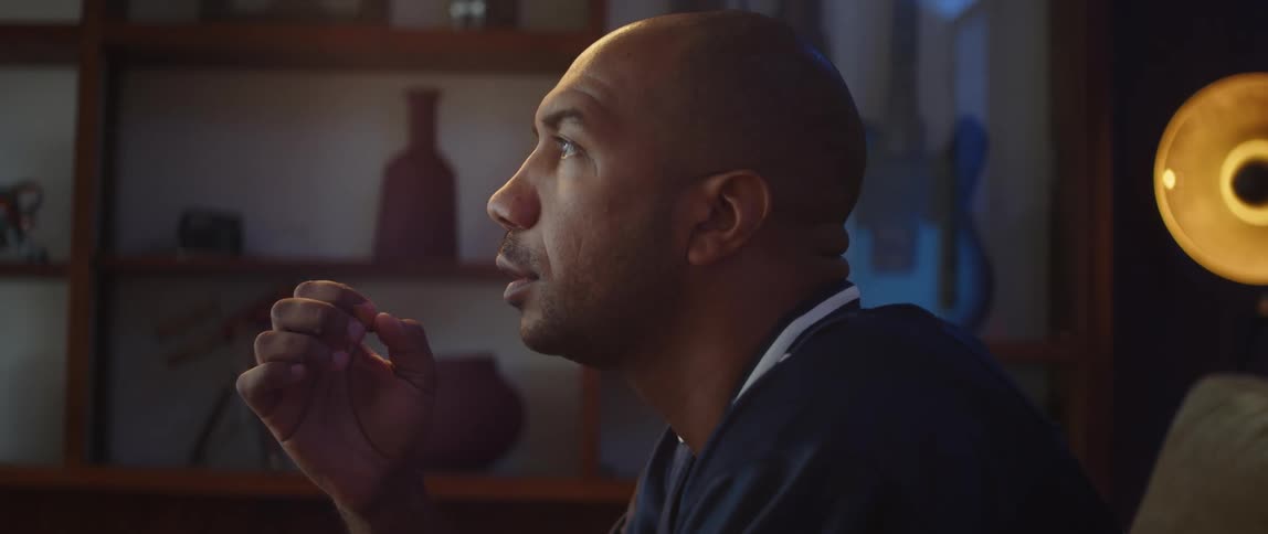 A man is watching something at home