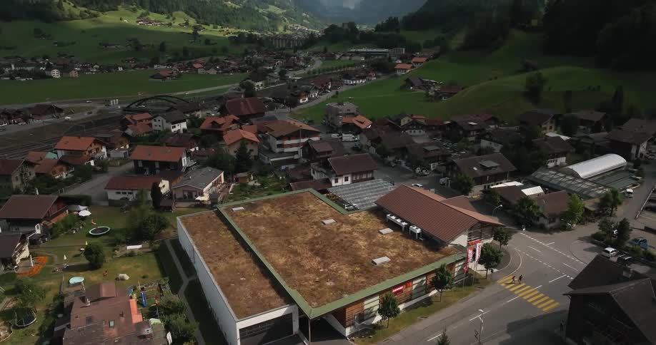 A neighborhood just beyond a mountain passage during the day