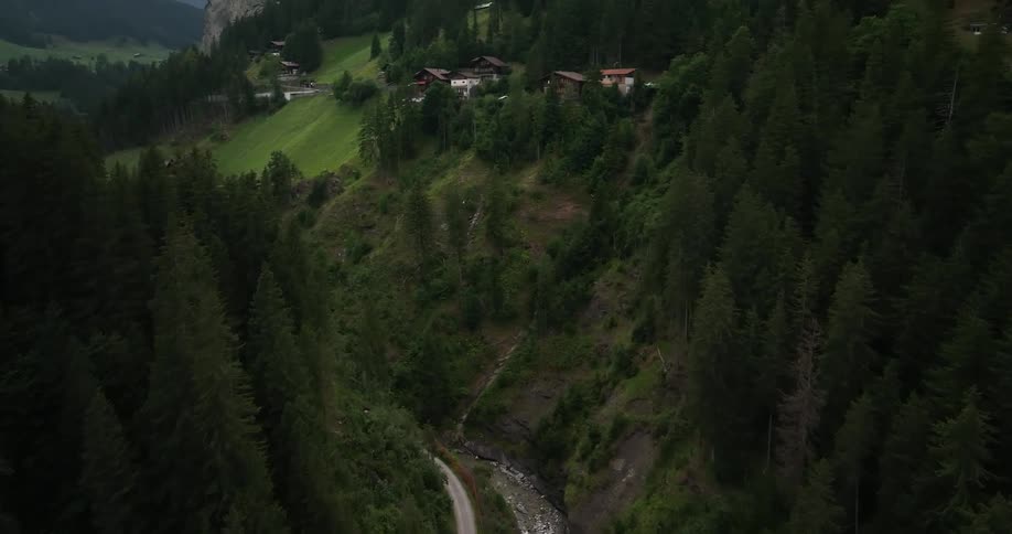 Aerial view of a small european town on a valley in the mountains at daytime