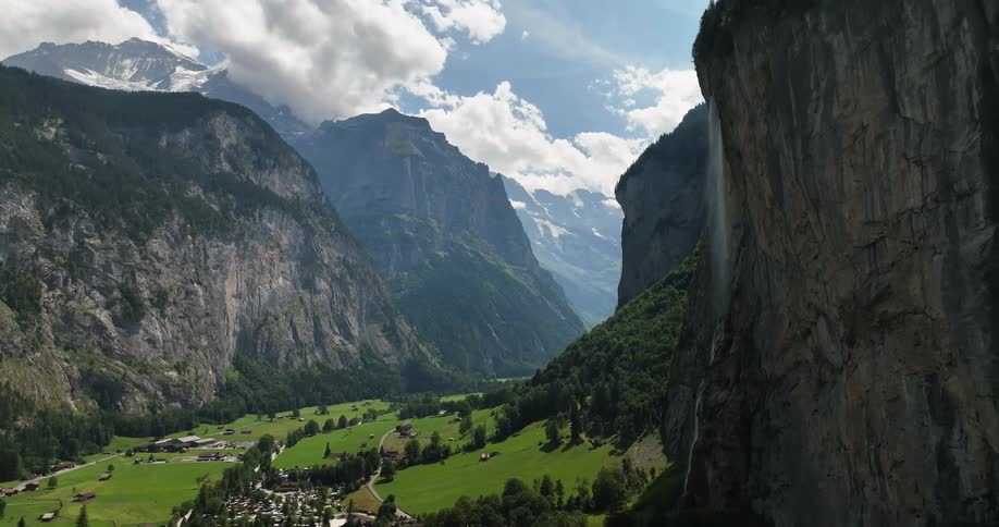 Aerial view of a small european town on a valley in the mountains at daytime
