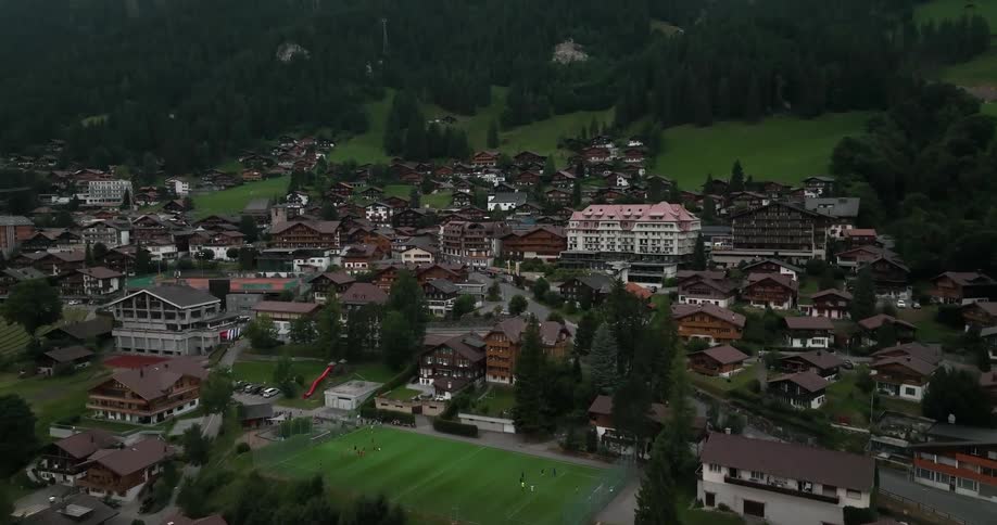 Aerial view of small city in green valley
