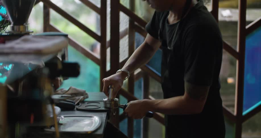 A man is preparing coffee in the restaurant