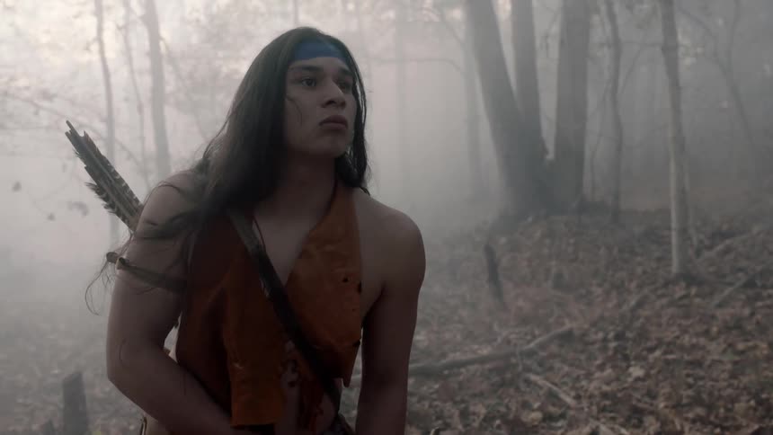 A native american looks into the distance