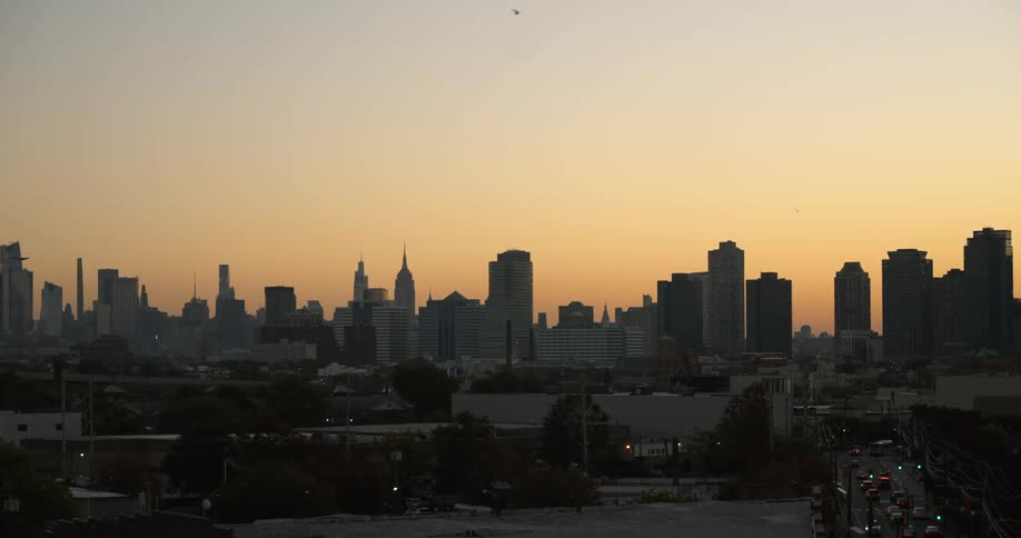 Silhouette of tall buildings in the city skyline at evening