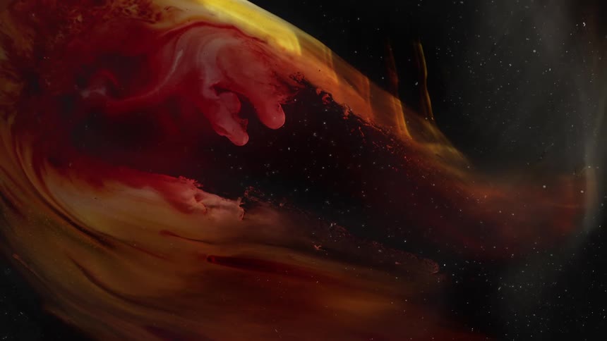 Clouds of intense dark clouds of red and yellow ink floating over a starlike background