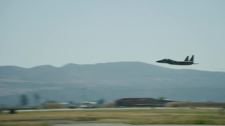 Air National Guard F-15 fighter jet scrambles to take off for a national airspace patrol flight