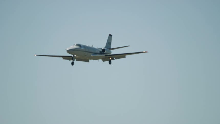 A twin jet passenger airplane approaches the airport on final for landing