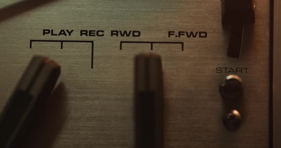 A person pushes a button on a recording device
