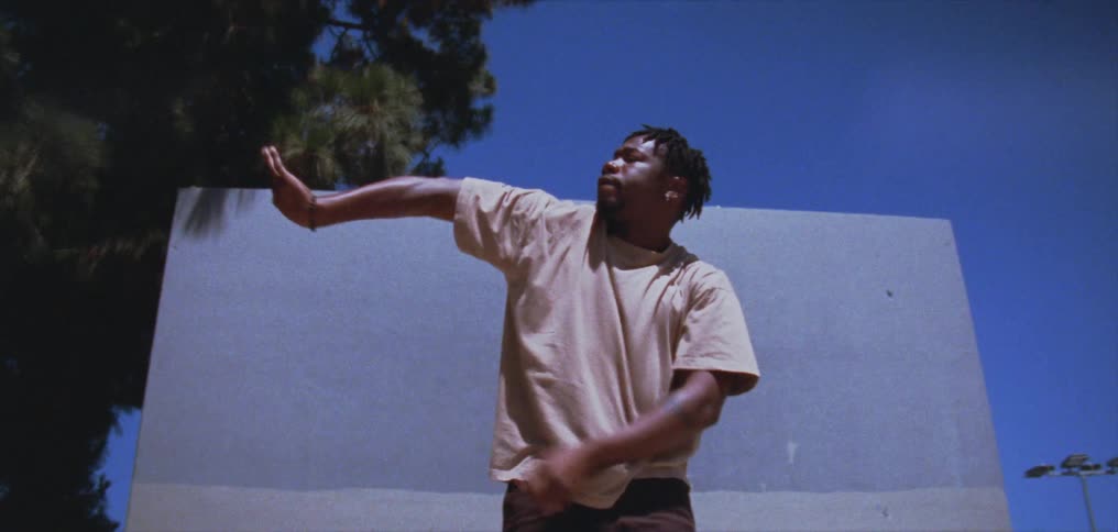 A man dances outside