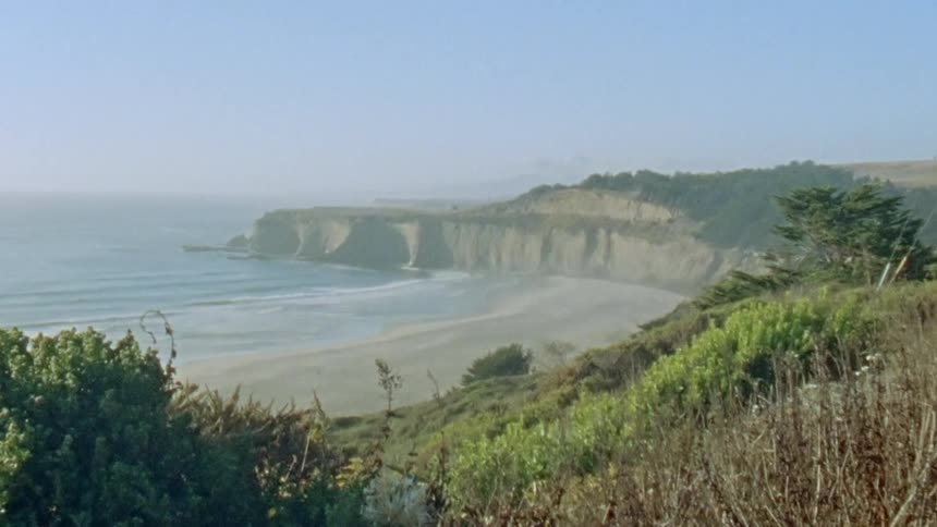 Ocean waves flowing towards a beach on the coast