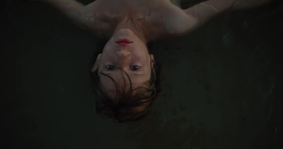 A boy is floating on his back in the water